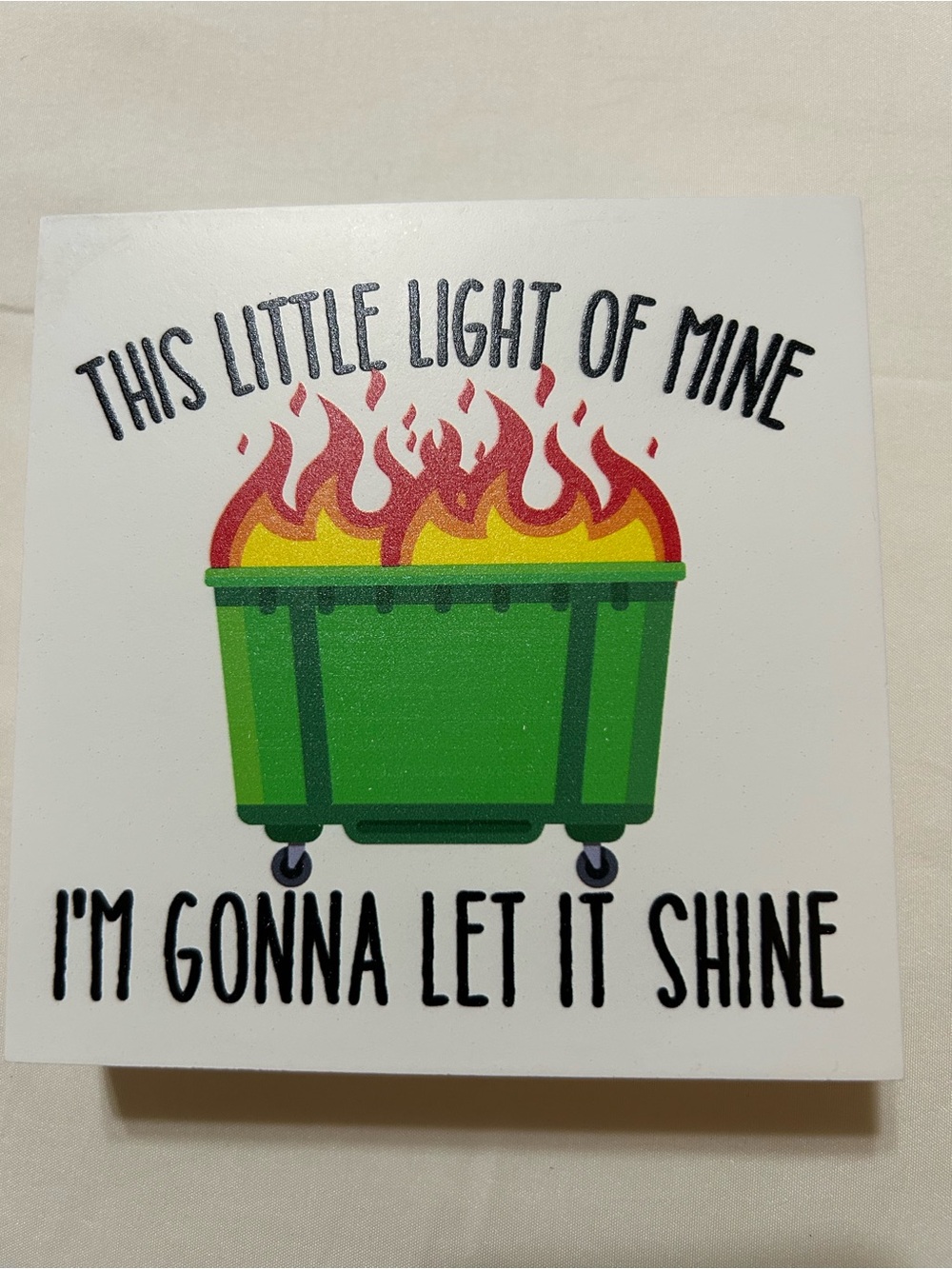 Dumpster Fire ‘this little light’ Green Dumpster picture with Red & Yellow Flame